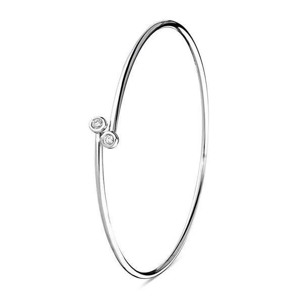 18ct white gold round bezel set diamond crossover bangle