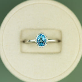 18 Karat White Gold Blue Topaz Halo Ring 0.95ct