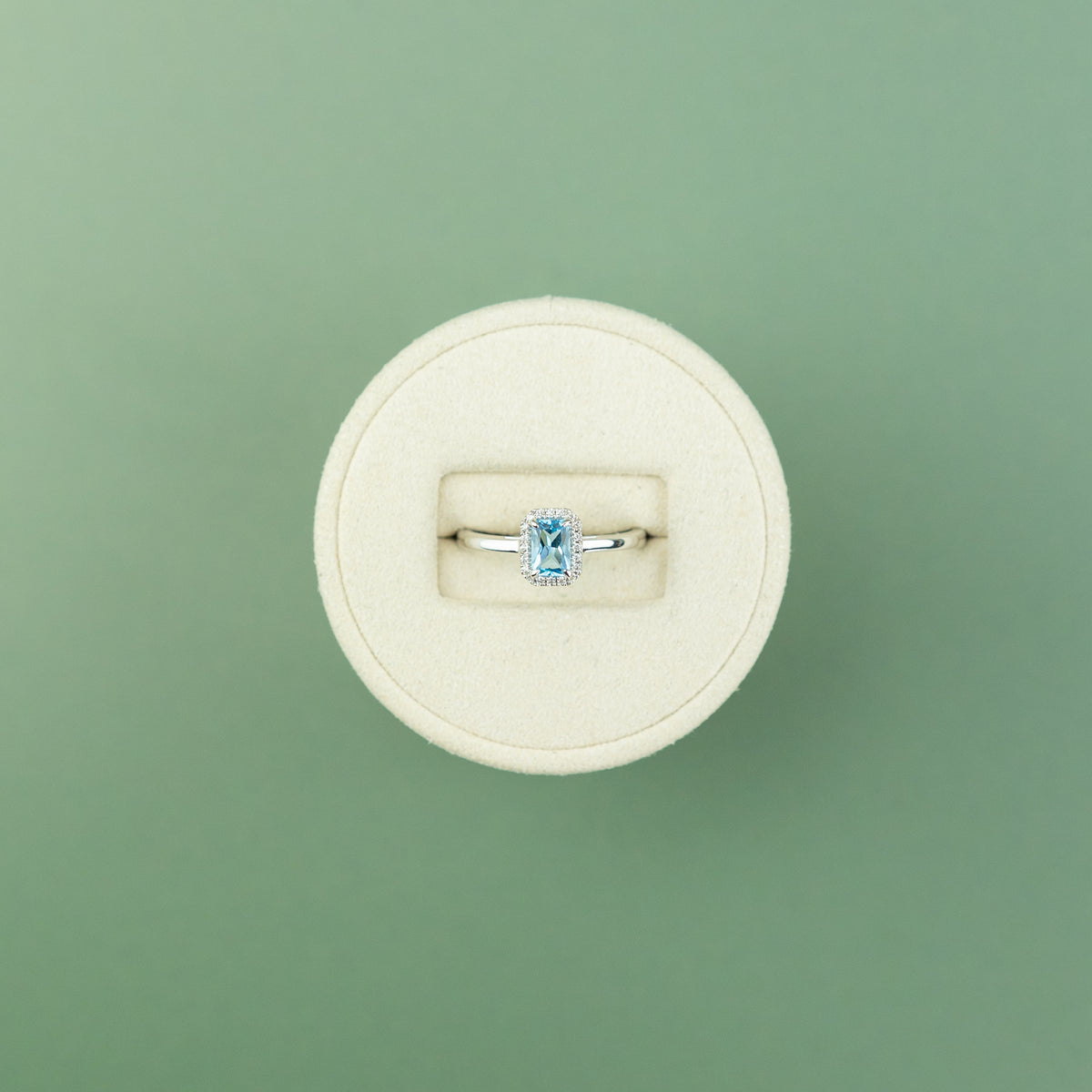 18 Karat White Gold Blue Topaz Emerald Cut Halo Ring 