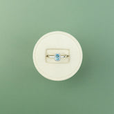 18 Karat White Gold Blue Topaz Emerald Cut Halo Ring 