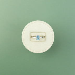 18 Karat White Gold Blue Topaz Emerald Cut Halo Ring 