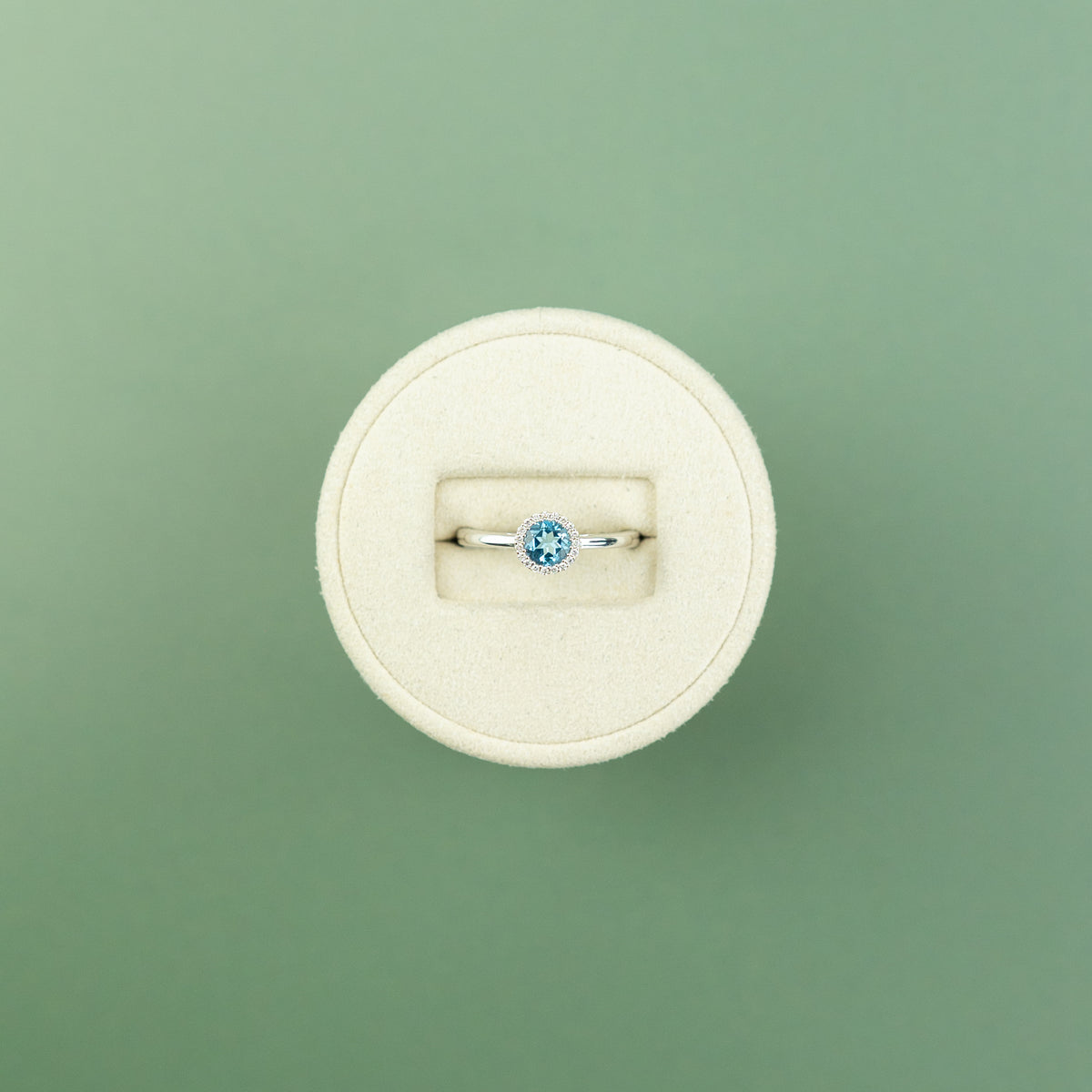 18 Karat White Gold Blue Topaz Round Halo Ring 0.56ct at RR Jewellers Yarm UK
