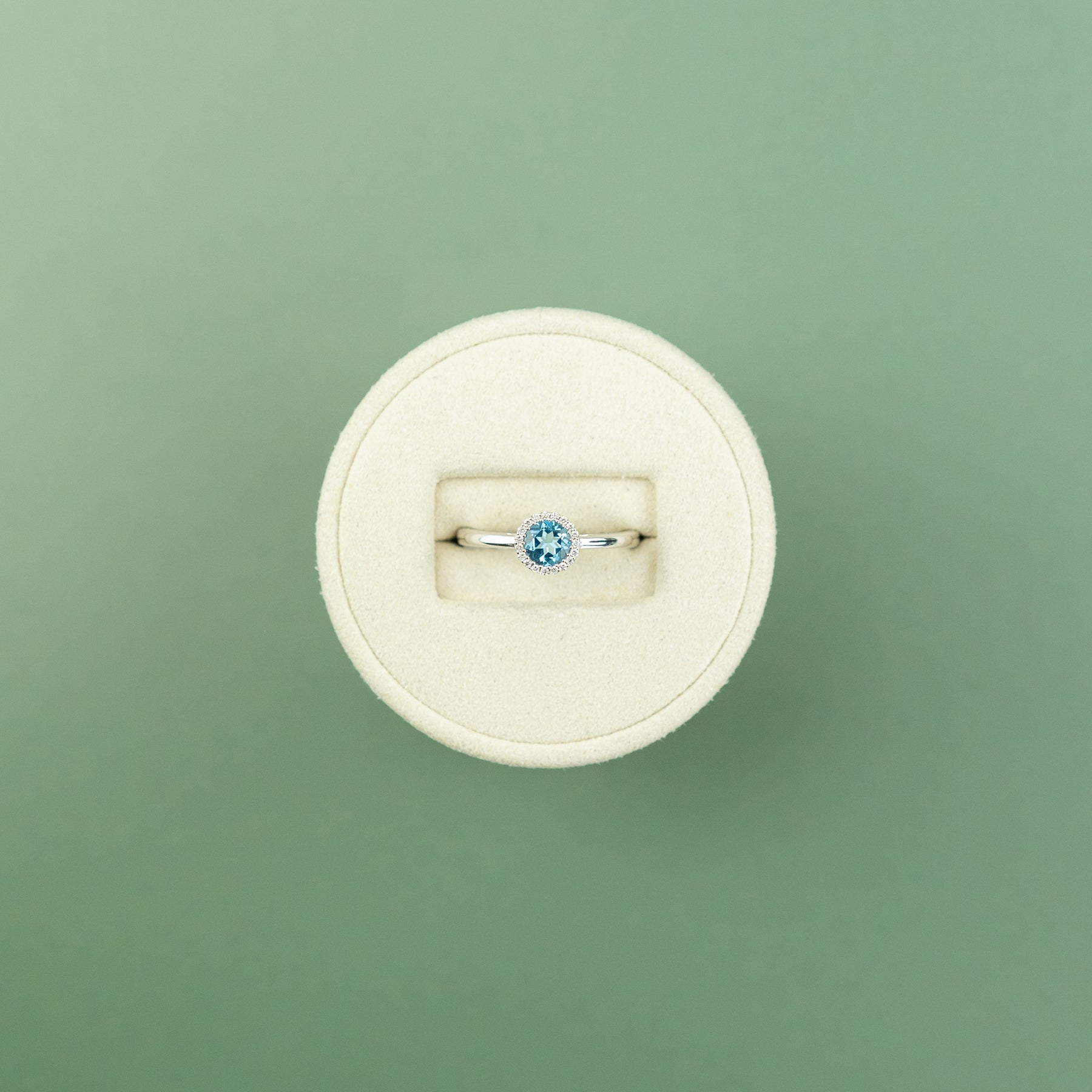 18 Karat White Gold Blue Topaz Round Halo Ring 0.56ct at RR Jewellers Yarm UK
