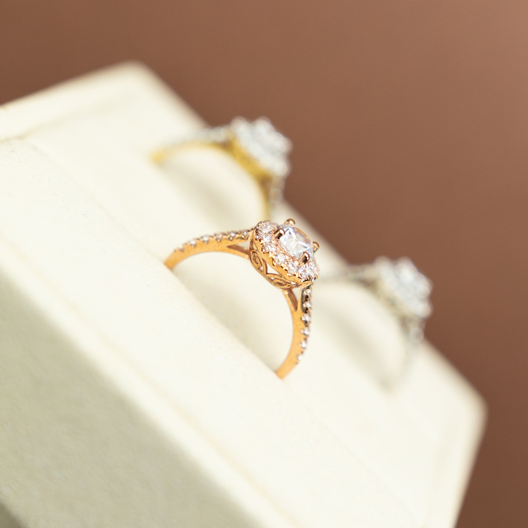 9 Karat Rose Gold Round CZ Halo Ring with CZ Shoulders at RR Jewellers Yarm UK