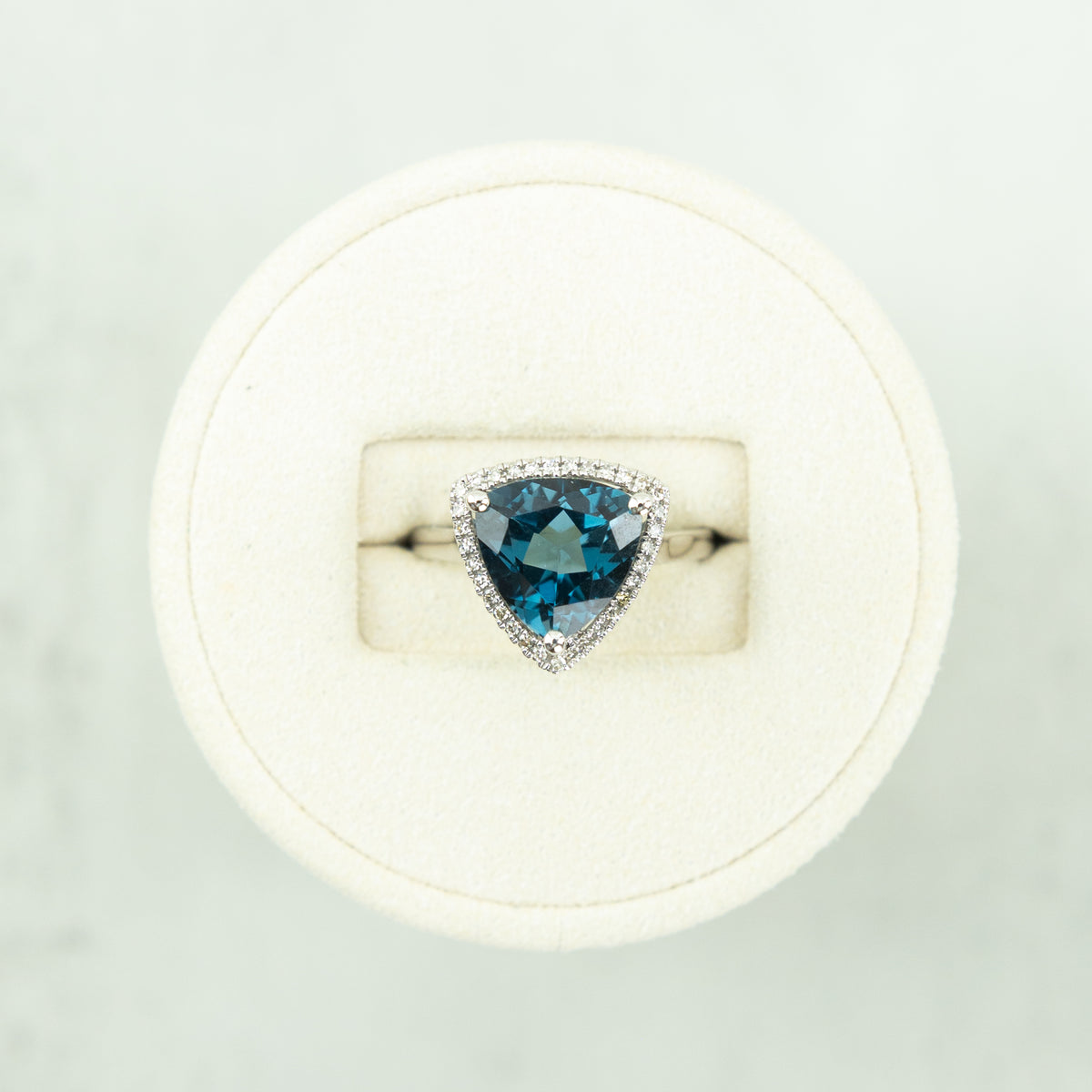 9 Karat White Gold Trillion Cut London Blue Topaz & Diamond Halo Ring at RR Jewellers Yarm UK 